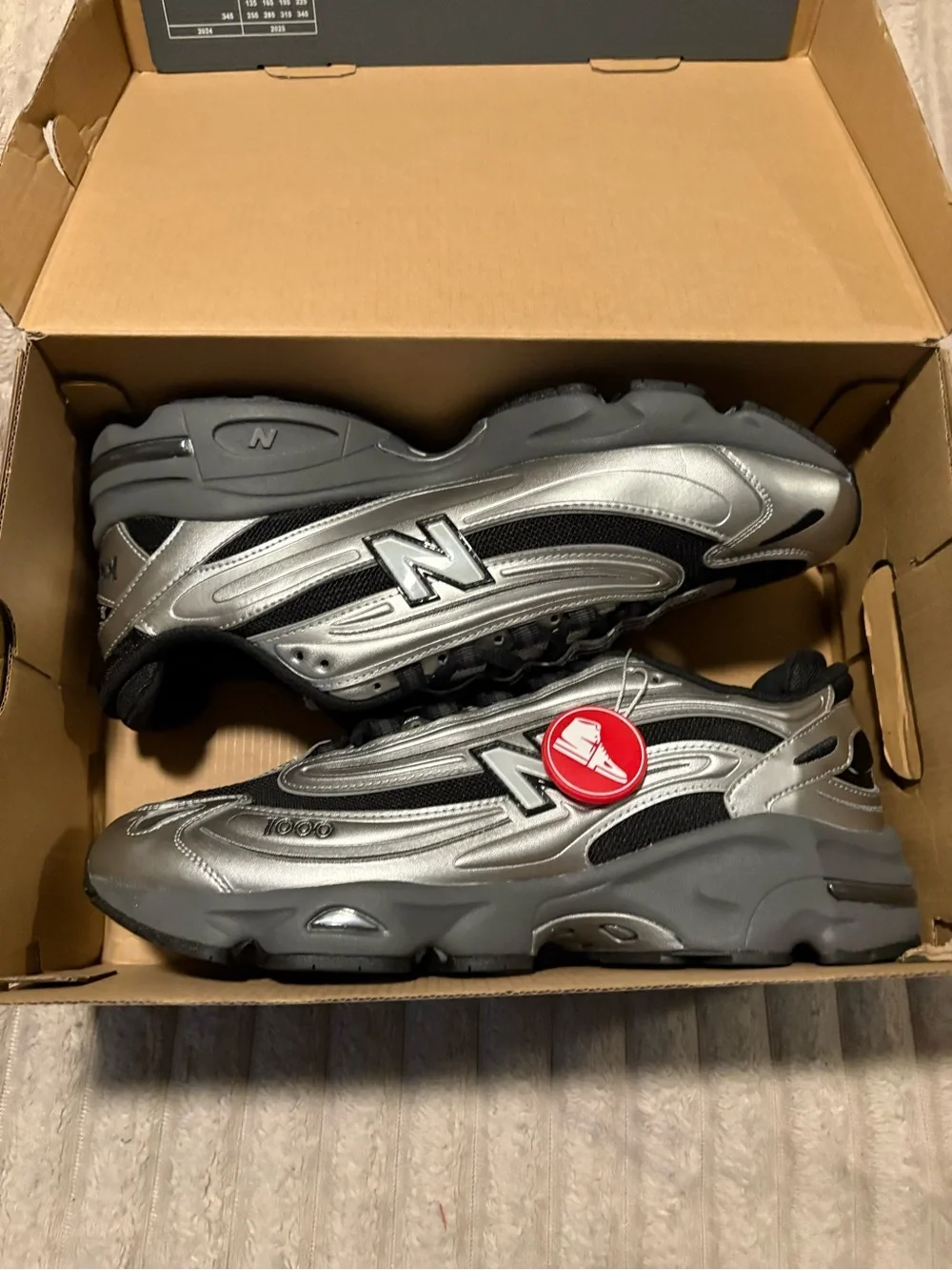 New Balance metallic silver